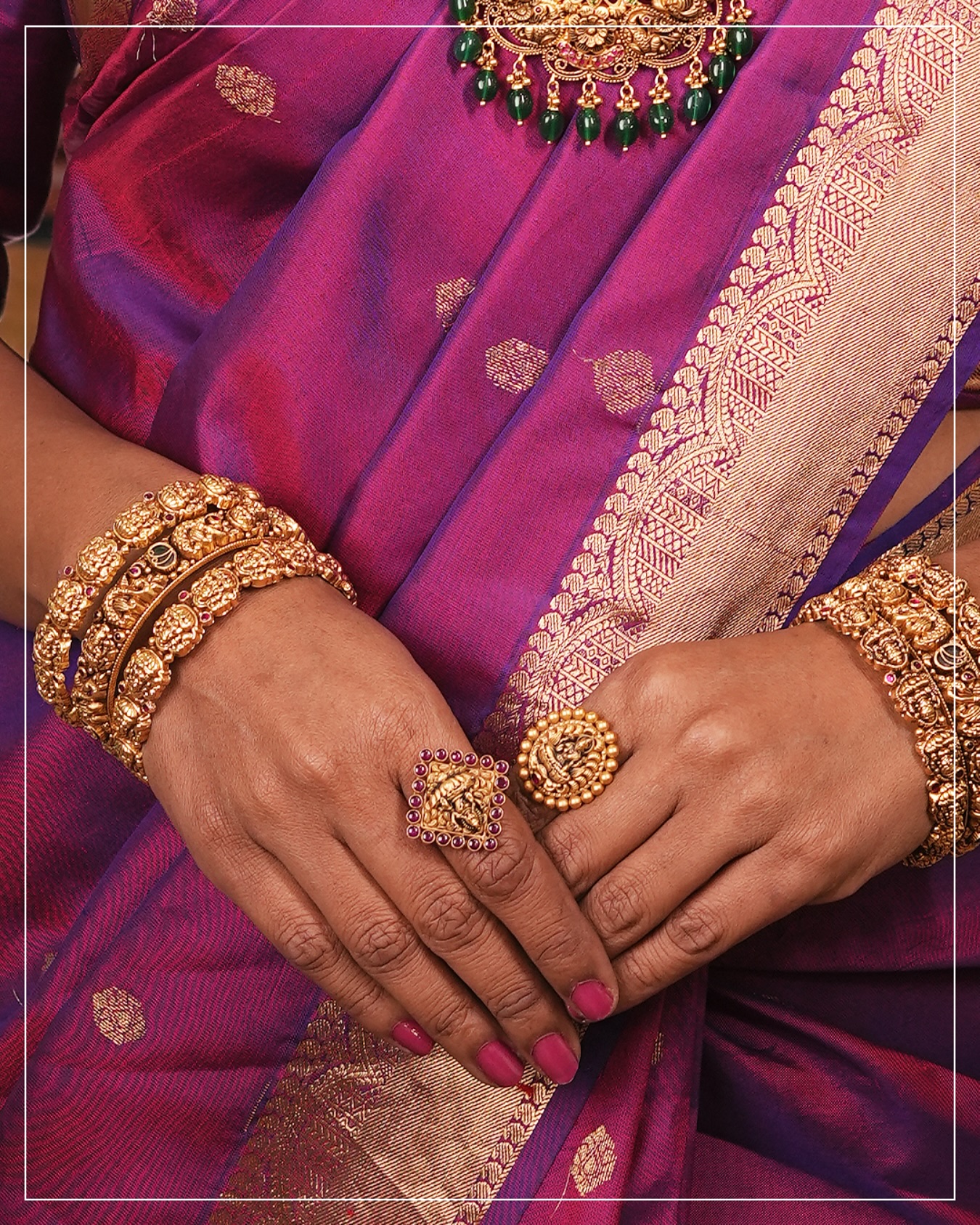 Bride at Atlas Aroosa wearing temple gold bangles and ring with a purple kanjivaram saree
